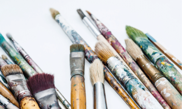 Painters cleaning brushes